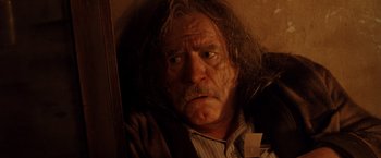 Movie still from “Trick 'r Treat” (2007), directed by Michael Dougherty – An older man with long hair and a beard; Close Up shot, Low angle