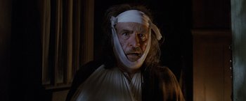 Movie still from “Trick 'r Treat” (2007), directed by Michael Dougherty – An old man with a bandage on his head; Close Up shot, Low angle