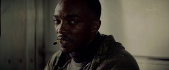 Movie still from “Triple 9” (2016), directed by John Hillcoat – A person with a cigarette in his mouth; Close Up shot, Low angle