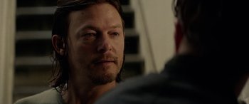 Movie still from “Triple 9” (2016), directed by John Hillcoat – A person looking at the camera; Close Up shot, Over the shoulder angle