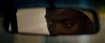 Movie still from “Triple 9” (2016), directed by John Hillcoat – A man's face through a window; Extreme Close Up shot, High angle