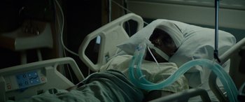 Movie still from “Triple 9” (2016), directed by John Hillcoat – A man in a hospital bed with a head injury; Close Up shot, High angle
