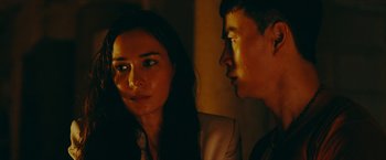 Movie still from “Triple Threat” (2019), directed by Jesse V. Johnson – A man and a woman looking at one another; Close Up shot, Over the shoulder angle