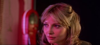 Movie still from “Tron” (1982), directed by Steven Lisberger – A person wearing a wig; Close Up shot, Low angle