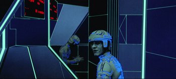 Movie still from “Tron” (1982), directed by Steven Lisberger – A man with a helmet is standing in front of a mirror; Medium shot, Low angle