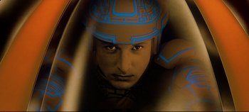 Movie still from “Tron” (1982), directed by Steven Lisberger – A man's face in a helmet; Close Up shot, Overhead angle