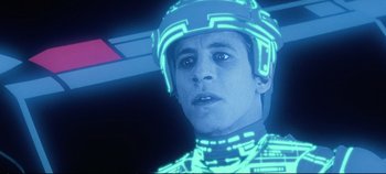 Movie still from “Tron” (1982), directed by Steven Lisberger – A person wearing a helmet; Close Up shot, Low angle