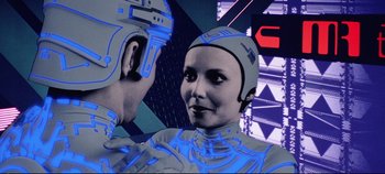 Movie still from “Tron” (1982), directed by Steven Lisberger – A woman and a man in a futuristic suit; Close Up shot, Low angle