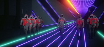 Movie still from “Tron” (1982), directed by Steven Lisberger – A group of people in a neon lit room; Extreme Wide shot, Low angle