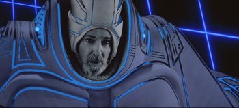 Movie still from “Tron” (1982), directed by Steven Lisberger – A man with a helmet on his head; Close Up shot, Low angle