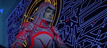 Movie still from “Tron” (1982), directed by Steven Lisberger – A man in a suit and helmet standing in front of an illuminated wall; Medium shot, Low angle