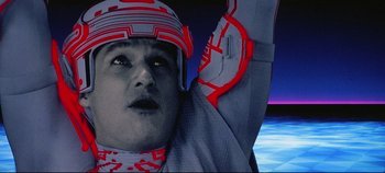 Movie still from “Tron” (1982), directed by Steven Lisberger – A person wearing a helmet; Close Up shot, Low angle
