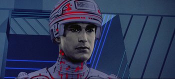 Movie still from “Tron” (1982), directed by Steven Lisberger – An image of a man with a helmet on his head; Close Up shot, Low angle