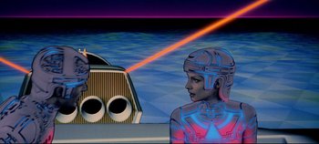 Movie still from “Tron” (1982), directed by Steven Lisberger – An image of a man and a woman in a futuristic setting; Medium shot, Low angle