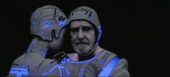 Movie still from “Tron” (1982), directed by Steven Lisberger – A person wearing a helmet; Close Up shot, Over the shoulder angle