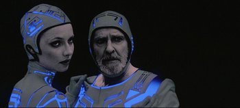 Movie still from “Tron” (1982), directed by Steven Lisberger – A man with a beard wearing a helmet; Close Up shot, Low angle