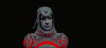 Movie still from “Tron” (1982), directed by Steven Lisberger – A person wearing a helmet; Close Up shot, Low angle