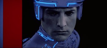 Movie still from “Tron” (1982), directed by Steven Lisberger – A person wearing a helmet; Close Up shot, Low angle