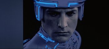 Movie still from “Tron” (1982), directed by Steven Lisberger – A person wearing a helmet; Close Up shot, Low angle