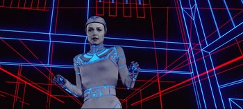 Movie still from “Tron” (1982), directed by Steven Lisberger – An image of a woman in a futuristic costume; Medium shot, Low angle