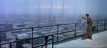 Movie still from “Tron” (1982), directed by Steven Lisberger – A view of a city from the top of a skyscraper; Extreme Wide shot, High angle