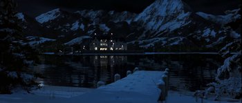 Movie still from “True Lies” (1994), directed by James Cameron – A night scene of a lake with a house in the background; Extreme Wide shot, Low angle