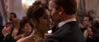 Movie still from “True Lies” (1994), directed by James Cameron – A man and a woman are dancing together; Close Up shot, Low angle