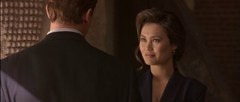 Movie still from “True Lies” (1994), directed by James Cameron – A man and a woman are looking at one another; Close Up shot, Over the shoulder angle