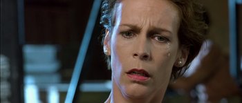 Movie still from “True Lies” (1994), directed by James Cameron – A person with a crying face; Close Up shot, Low angle
