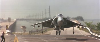 Movie still from “True Lies” (1994), directed by James Cameron – A fighter jet taking off from an airport runway; Wide shot, Low angle