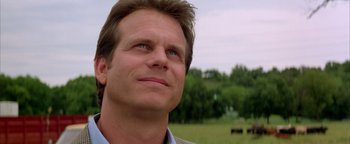 Movie still from “Twister” (1996), directed by Jan de Bont – A person looking up at something; Close Up shot, Low angle