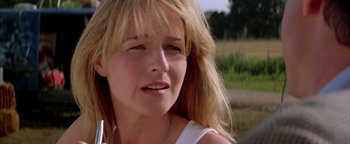Movie still from “Twister” (1996), directed by Jan de Bont – A person with long blonde hair; Close Up shot, Low angle