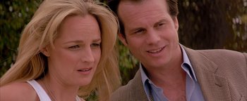 Movie still from “Twister” (1996), directed by Jan de Bont – A man and a woman standing next to each other; Close Up shot, Over the shoulder angle