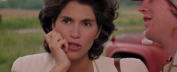 Movie still from “Twister” (1996), directed by Jan de Bont – A person with her hand on her face; Close Up shot, Over the shoulder angle
