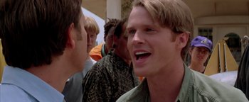 Movie still from “Twister” (1996), directed by Jan de Bont – A group of young men standing next to each other; Close Up shot, Over the shoulder angle