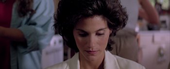 Movie still from “Twister” (1996), directed by Jan de Bont – A woman's face in a white jacket; Close Up shot, High angle