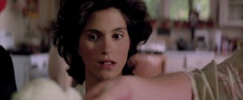 Movie still from “Twister” (1996), directed by Jan de Bont – A woman's face in a room; Close Up shot, Over the shoulder angle