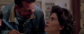 Movie still from “Twister” (1996), directed by Jan de Bont – A man and a woman looking at one another; Close Up shot, Over the shoulder angle