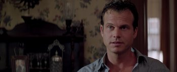 Movie still from “Twister” (1996), directed by Jan de Bont – A person in a room; Close Up shot, Over the shoulder angle