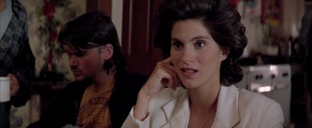 Movie still from “Twister” (1996), directed by Jan de Bont – A woman sitting next to a man in a room; Close Up shot, Over the shoulder angle