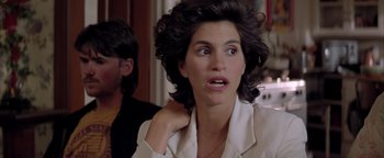 Movie still from “Twister” (1996), directed by Jan de Bont – A person wearing a white shirt; Close Up shot, Over the shoulder angle