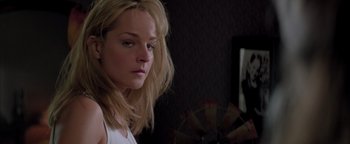 Movie still from “Twister” (1996), directed by Jan de Bont – A woman with blonde hair is looking at the camera; Close Up shot, Over the shoulder angle