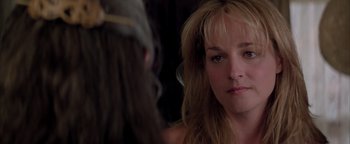 Movie still from “Twister” (1996), directed by Jan de Bont – A person looking at a mirror; Close Up shot, Over the shoulder angle