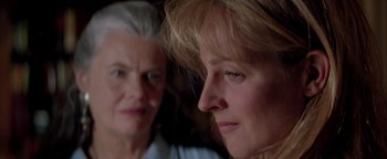 Movie still from “Twister” (1996), directed by Jan de Bont – Two older women looking at each other in a room; Close Up shot, Over the shoulder angle