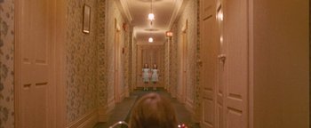 Movie still from “Twister” (1996), directed by Jan de Bont – Two little girls are standing in a hallway; Wide shot, Low angle