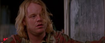 Movie still from “Twister” (1996), directed by Jan de Bont – A person with long blonde hair; Close Up shot, Over the shoulder angle