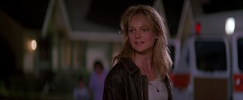 Movie still from “Twister” (1996), directed by Jan de Bont – A woman with long blonde hair wearing a leather jacket; Close Up shot, Low angle