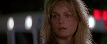 Movie still from “Twister” (1996), directed by Jan de Bont – A person with long blonde hair; Close Up shot, Over the shoulder angle