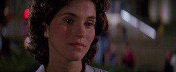 Movie still from “Twister” (1996), directed by Jan de Bont – A woman's face in the dark; Close Up shot, Over the shoulder angle