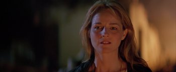 Movie still from “Twister” (1996), directed by Jan de Bont – A person wearing a black shirt; Close Up shot, Low angle